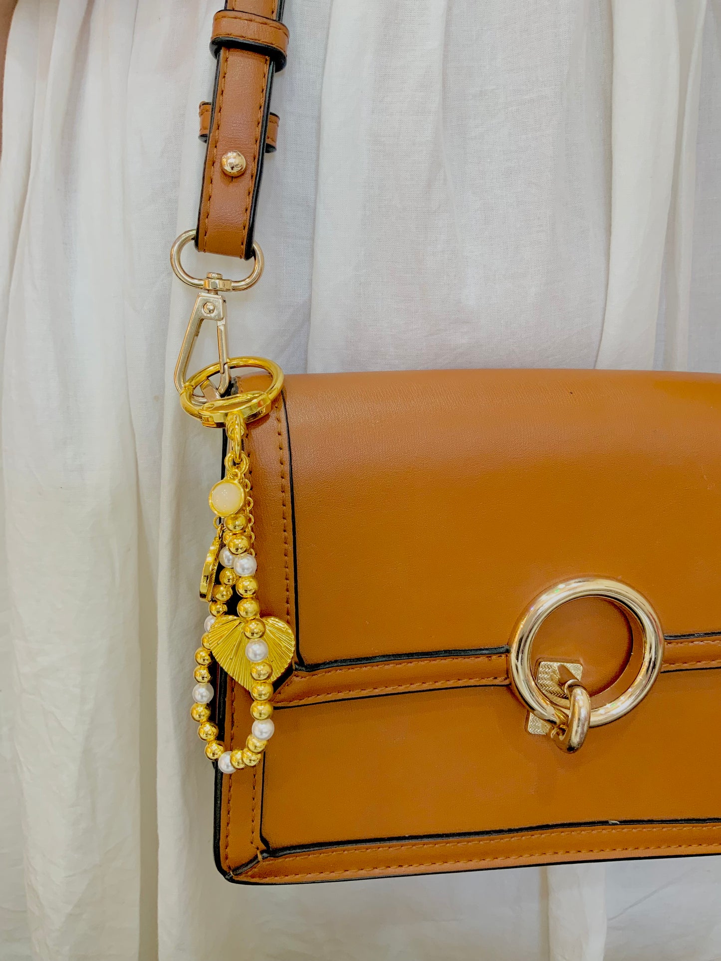 Golden aura bag charm