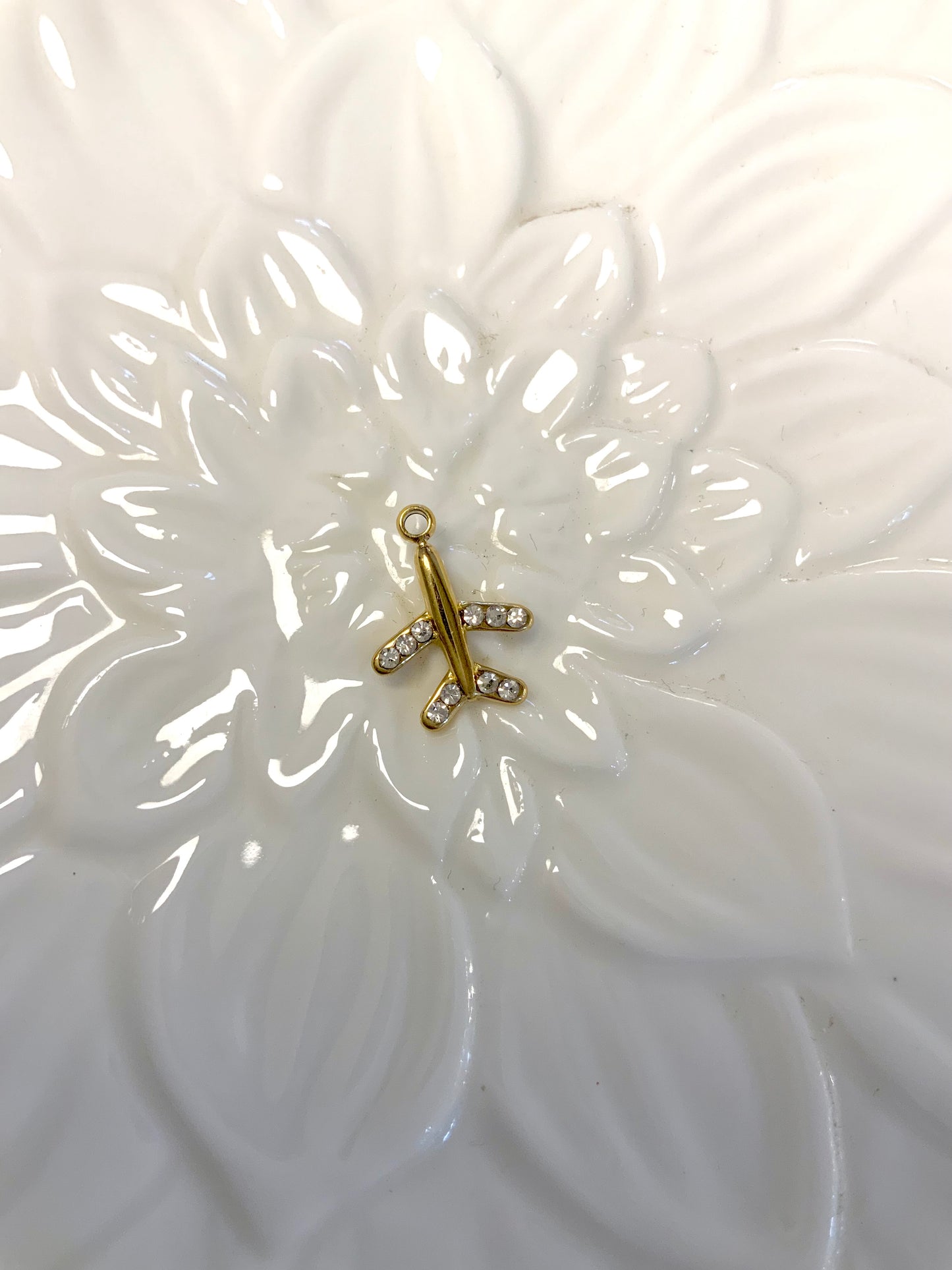 Golden airplane charm