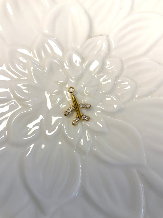 Golden airplane charm