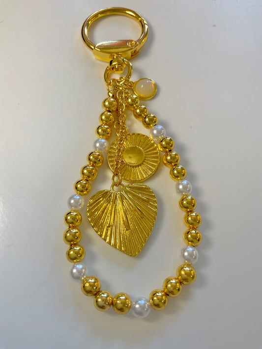Golden aura bag charm